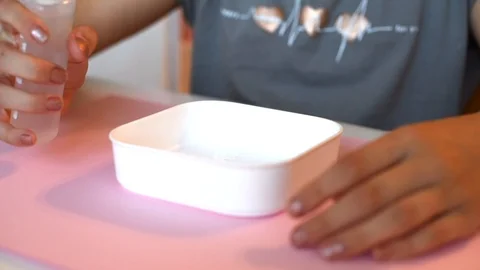 Child making slime - step by step guide. playing with slime. Stock Footage 111892849