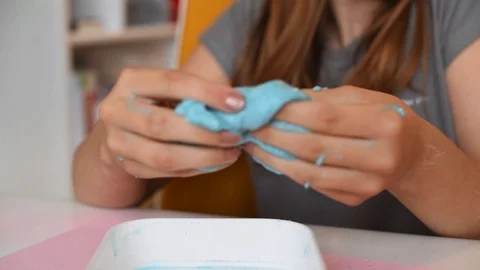 Child making slime - step by step guide. playing with slime. Stock Footage 111892893