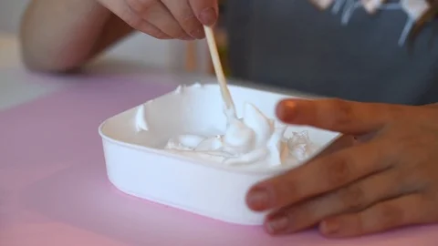 Child making slime - step by step guide. playing with slime. Stock Footage 111893058