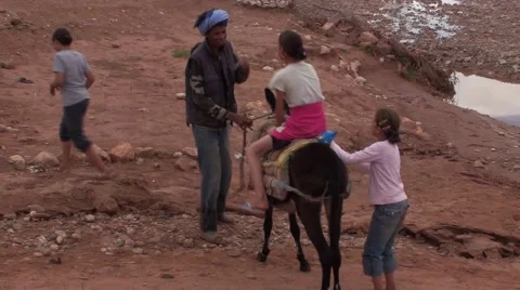 Child making a stroll on a Donkey in Morocco Stock Footage 52895208
