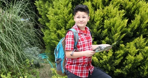 Child with map walking at the nature alone Stock Footage 105474699