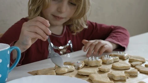 Child Messing Up Decorating Cookies Stock Footage 98719930
