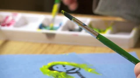 Child mixes paint Stock Footage 11016342