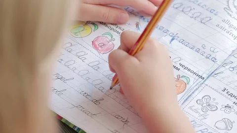 Child with mom doing homework Stock Footage 157883251