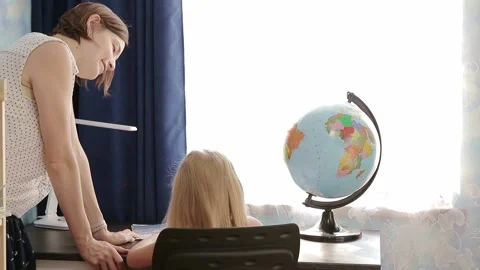 Child with mom doing homework Stock Footage 157883258