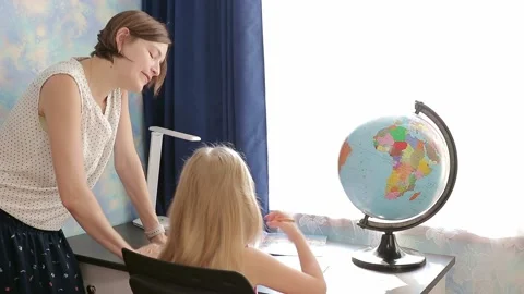 Child with mom doing homework Stock Footage 157883260
