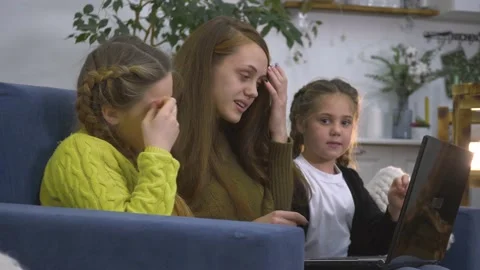 Child, mom study remotely through laptop. Family education on computer. Remote Stock Footage 167312600
