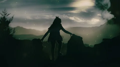 A child on a mountain observes colored particles Stock-Footage 141110049
