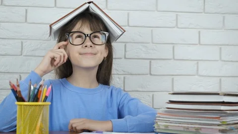 Child nerd with a book. Stock Footage 104359314