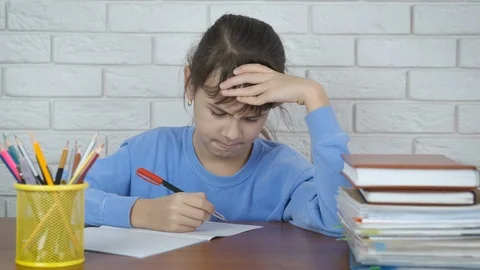 The child is nervous doing homework. Stock Footage 105582143