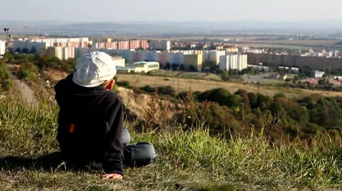Child observes a town Stock Footage 8838557