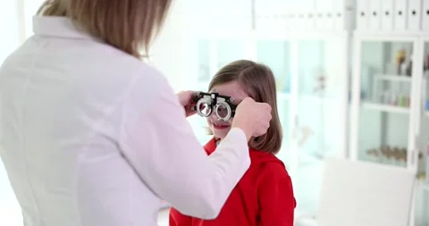 Child with oculist trial frame in vision clinic Video stock 263304526