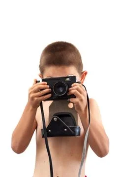 Child with an old camera on a white background Stock Photos
