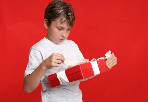 Child opening a present Stock Photos