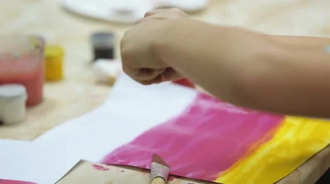 Child opens a jar of paint Stock Footage 59594988