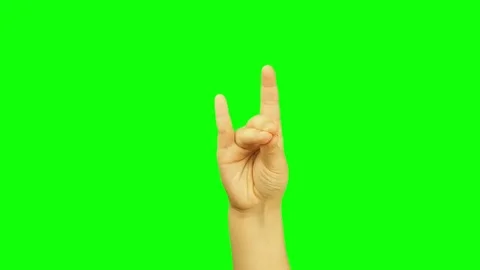 Child or kid hand making wolf gesture and playing the show isolated green screen Stock Footage 73821457