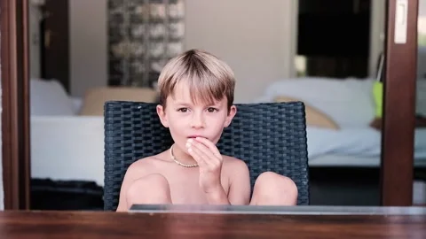 Child outdoor eating a refreshing slice of watermelon  Stock-Footage 136814614