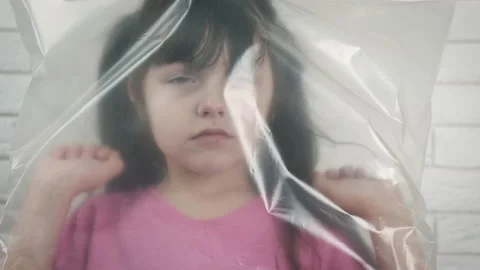 Child in packaging. Video stock 130814439