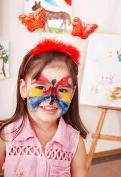 Child with paint of face. Stock-Fotos