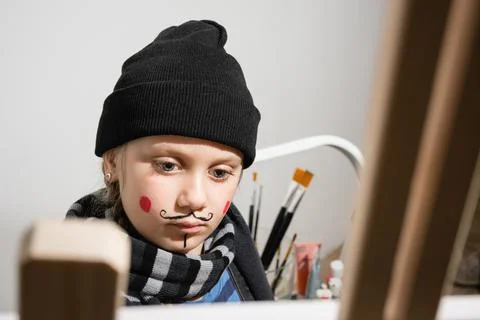 Child with a painted face Stock Photos
