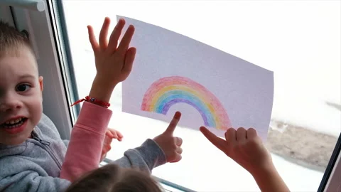 The child painted a rainbow on the window. Selective focus. Stock Footage 170513481