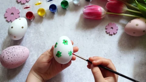 Child painting Easter egg at home Stock Footage 268982041
