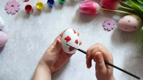 Child painting Easter egg at home Stock Footage 268982092