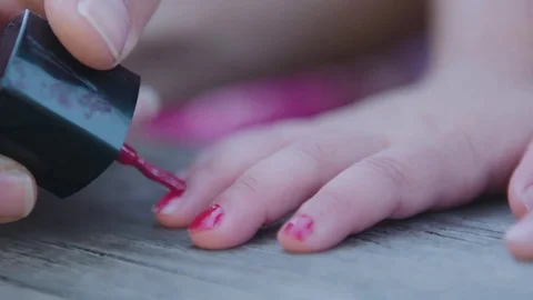 Child painting nails Stock Footage 76728959