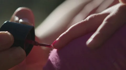 Child painting nails Stock Footage 76729359