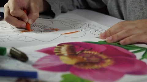 Child paints coloring with crayons Stock Footage 82490579