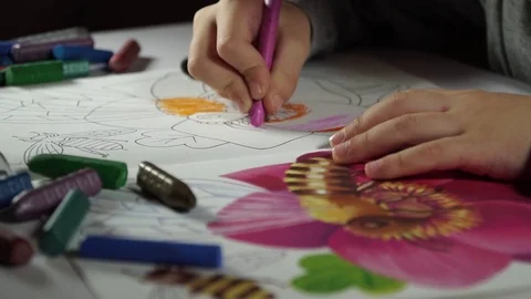 Child paints coloring with crayons Stock Footage 82490603