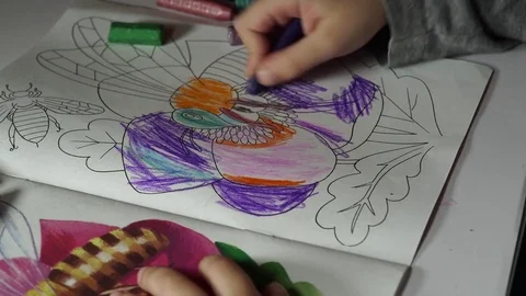 Child paints coloring with crayons Stock Footage 82490686
