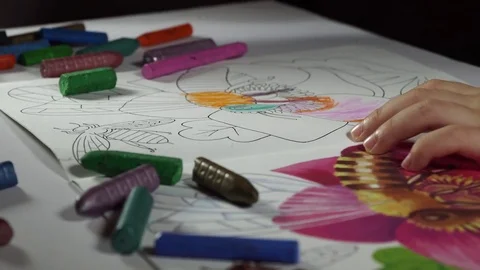 Child paints coloring with crayons Stock Footage 82490687