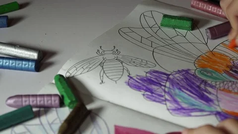Child paints coloring with crayons Stock Footage 82490775
