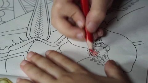 Child paints coloring with crayons Stock Footage 82490854