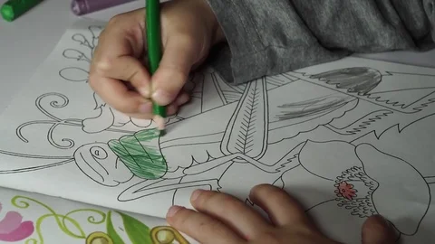Child paints coloring with crayons Stock Footage 82490966