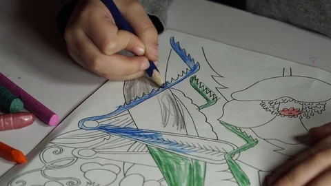 Child paints coloring with crayons Stock Footage 82491090
