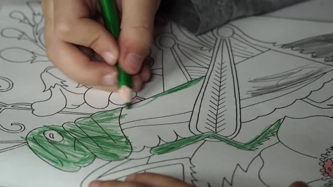Child paints coloring with crayons Stock Footage 82491093