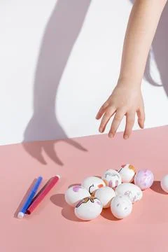 Child paints Easter eggs Stock Photos