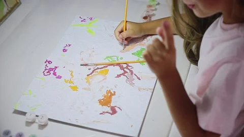Child paints at the table Stock Footage 166166581