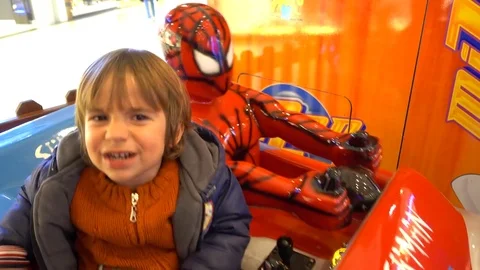 Child in panic attack when riding with Spiderman Stock Footage 72601663