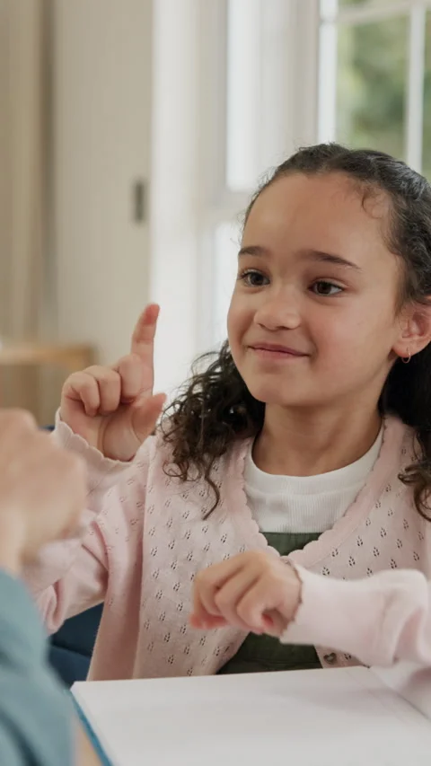 Child, parents and learning with hands in home for sign language, education or Stock Footage 338187322