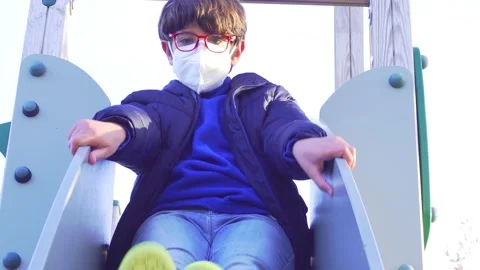 Child in park with mask Stock Footage 171336674