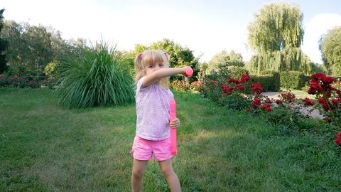 A child in the Park playing with soap bubbles. Video stock 95495594