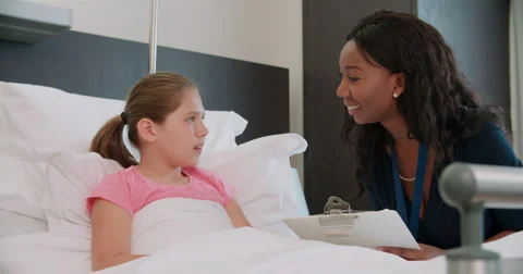 Child Patient In Bed Talking To Doctor In Hospital Room Stock Footage