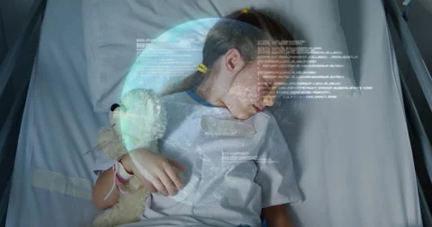 Child patient hugging teddy bear seeing globe and code overlay initiating Stock Footage 310970705