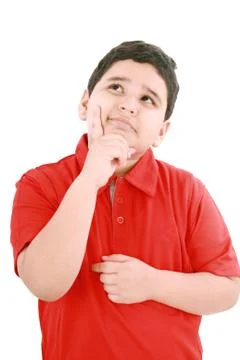 Child with a pensive expression looking up. isolated on white background. Fotos de archivo