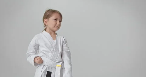 The child performs a special exercise for karate. A diligent athlete performs Stock Footage