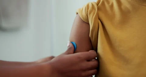 Child, plaster and hands of parent for injury, bruise or sore arm with first aid Stock Footage 337545008