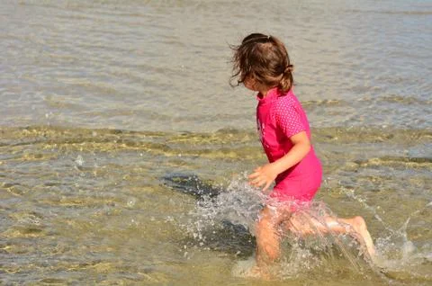 Child play on the beach Stock Photos